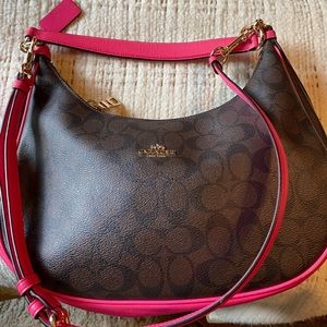 Coach handbag in hot pink and brown coated canvas.
